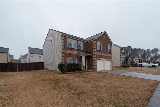 view of front of home with a garage and a front yard