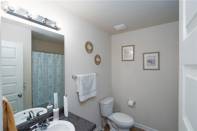 bathroom with sink and toilet