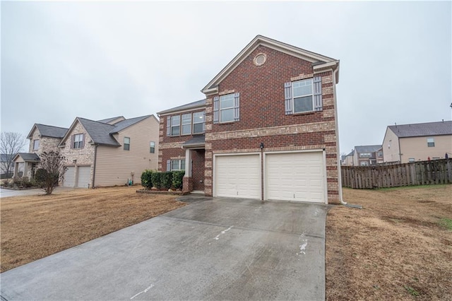 view of front of house with a garage and a front lawn