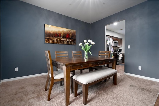 dining area featuring carpet floors