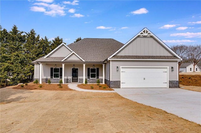 craftsman inspired home with a garage and a porch