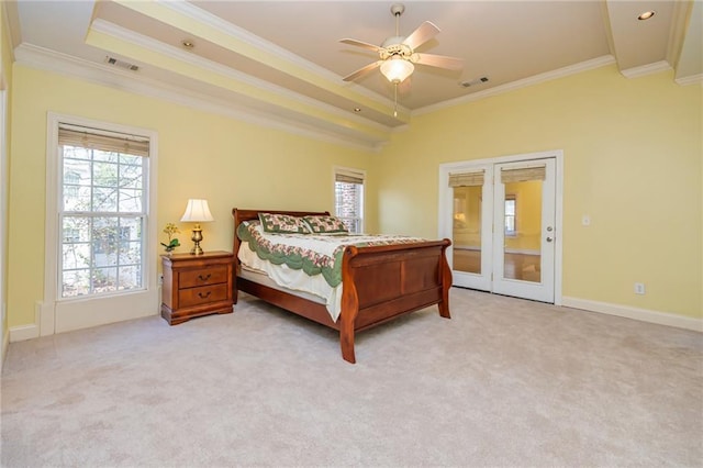 carpeted bedroom with ceiling fan and ornamental molding