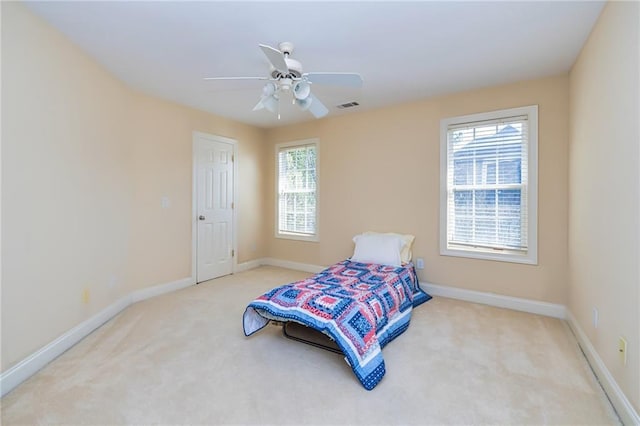 carpeted bedroom with ceiling fan