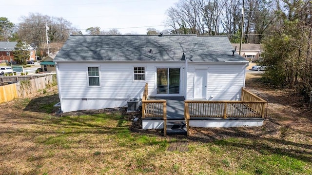 rear view of property with fence, central AC, crawl space, a deck, and a lawn