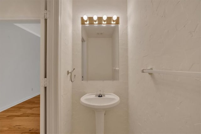 bathroom with wood finished floors