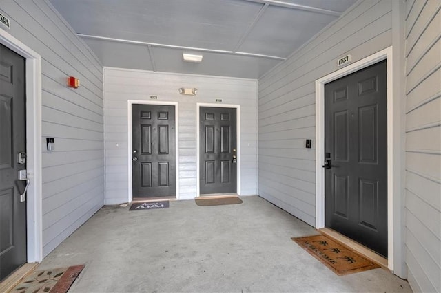 view of exterior entry featuring a porch