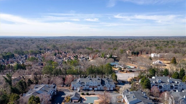 drone / aerial view with a residential view and a forest view