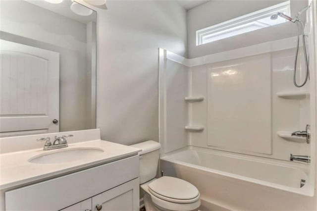 full bath with toilet, vanity, and washtub / shower combination