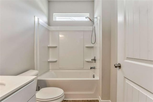bathroom featuring toilet, vanity, and shower / bathtub combination
