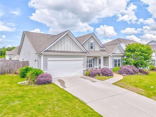 craftsman house featuring board and batten siding, a garage, concrete driveway, and roof with shingles
