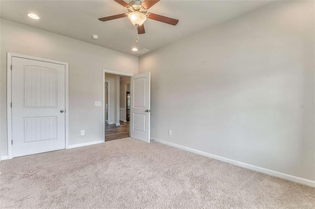 unfurnished bedroom with carpet floors, baseboards, recessed lighting, and a ceiling fan