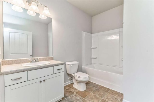 full bath featuring toilet, vanity, baseboards, and shower / tub combination
