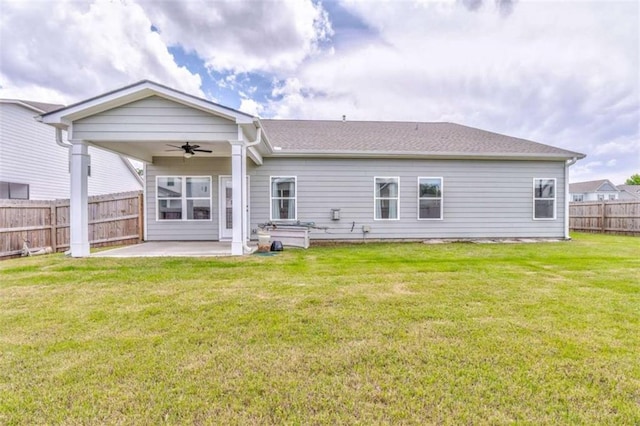 rear view of property featuring a ceiling fan and a patio