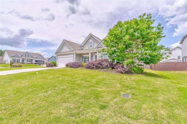 view of front of property featuring board and batten siding, an attached garage, and driveway