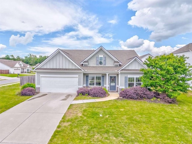 view of front of home featuring board and batten siding, driveway, and a shingled roof