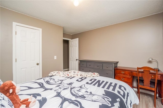 bedroom with light hardwood / wood-style flooring