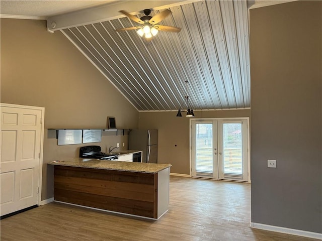 kitchen with french doors, light wood-type flooring, stainless steel refrigerator, and black stove