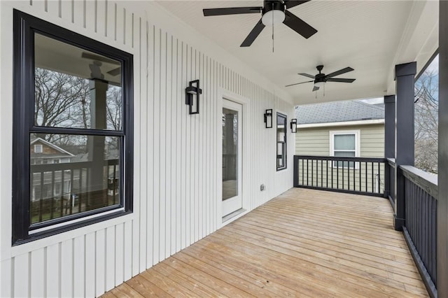 wooden deck featuring ceiling fan