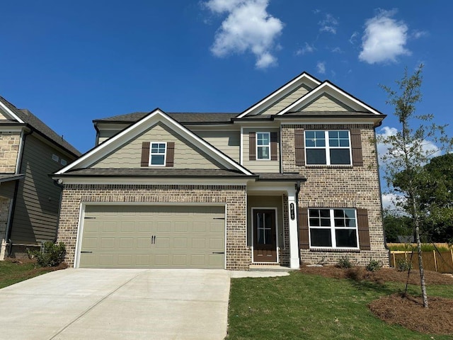141 Wingate Dr, Auburn, GA 30680 - craftsman-style house with brick siding, concrete driveway, and a garage