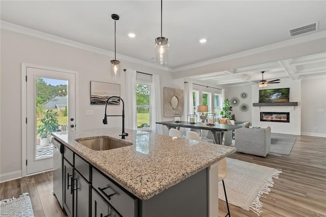 141 Wingate Dr, Auburn, GA 30680 - kitchen with a kitchen island with sink, coffered ceiling, light wood-type flooring, ceiling fan, and dishwasher