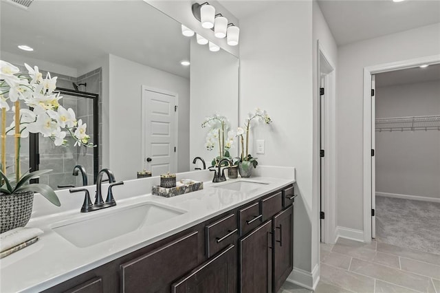 141 Wingate Dr, Auburn, GA 30680 - full bath featuring double vanity, a shower stall, a spacious closet, and recessed lighting
