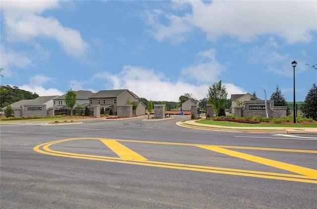 141 Wingate Dr, Auburn, GA 30680 - view of asphalt street featuring sidewalks, street lighting, a residential view, and curbs