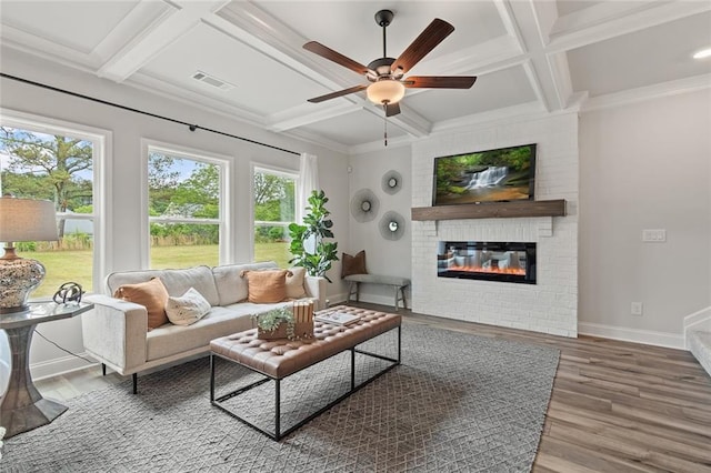 141 Wingate Dr, Auburn, GA 30680 - living room with coffered ceiling, a ceiling fan, wood finished floors, a fireplace, and beamed ceiling