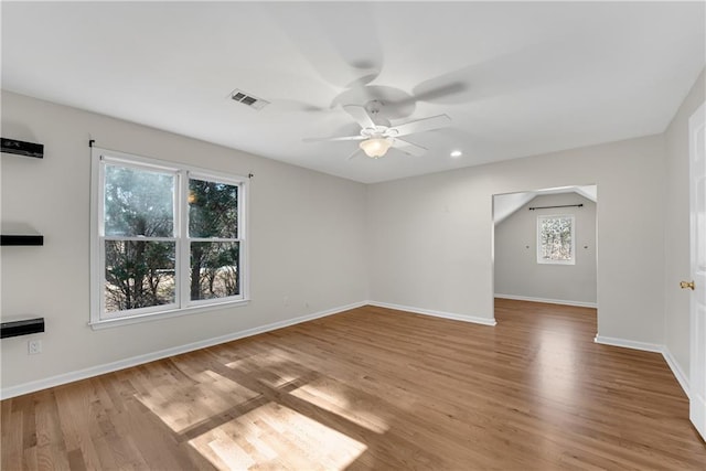 empty room with light hardwood / wood-style floors and ceiling fan