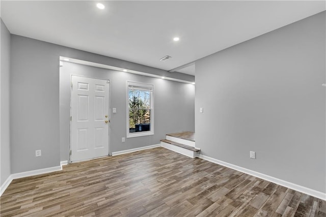 unfurnished room featuring hardwood / wood-style floors