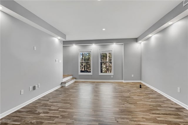 empty room with hardwood / wood-style flooring