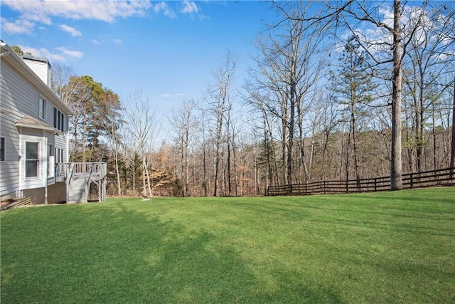 view of yard featuring a wooden deck