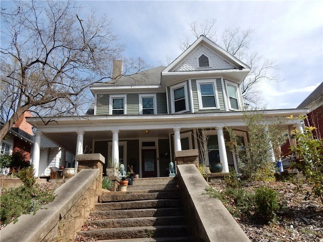 victorian house featuring a porch