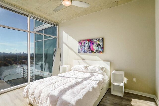 bedroom featuring access to outside, ceiling fan, and wood-type flooring