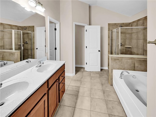 4206 Weavers White Ln Unit 17, Austell, GA 30106 - bathroom featuring tile patterned floors, independent shower and bath, lofted ceiling, and dual bowl vanity