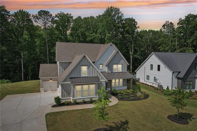 8125 Beryl Overlook, Gainesville, GA 30506 - modern farmhouse style home featuring board and batten siding, concrete driveway, a standing seam roof, and a yard