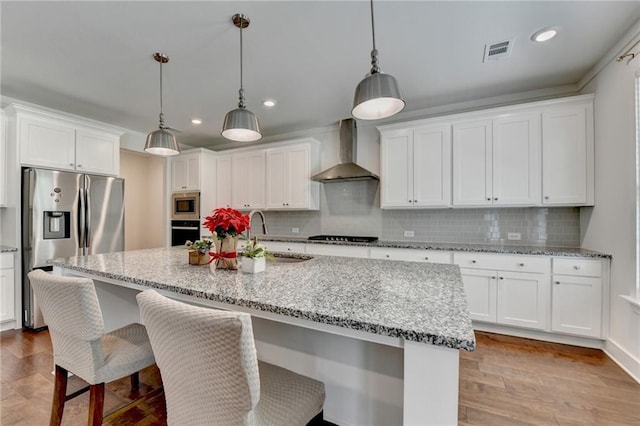 8125 Beryl Overlook, Gainesville, GA 30506 - kitchen with wall chimney range hood, white cabinetry, a sink, appliances with stainless steel finishes, and visible vents