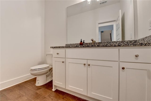 8125 Beryl Overlook, Gainesville, GA 30506 - bathroom with baseboards, visible vents, toilet, and vanity