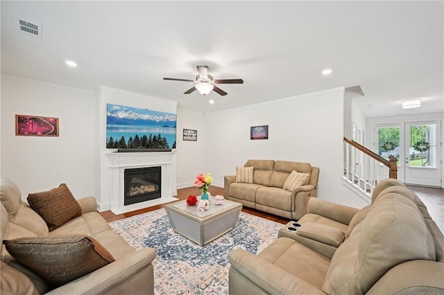 8125 Beryl Overlook, Gainesville, GA 30506 - living area featuring a ceiling fan, recessed lighting, ornamental molding, wood finished floors, and stairs