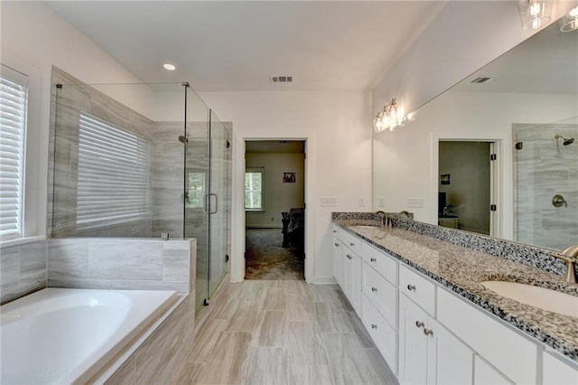 8125 Beryl Overlook, Gainesville, GA 30506 - full bathroom featuring double vanity, visible vents, a shower stall, and a sink