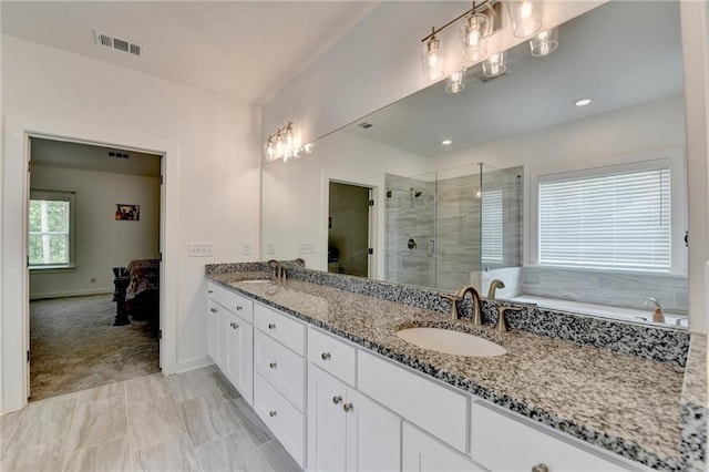 8125 Beryl Overlook, Gainesville, GA 30506 - ensuite bathroom with visible vents, a stall shower, double vanity, and a sink
