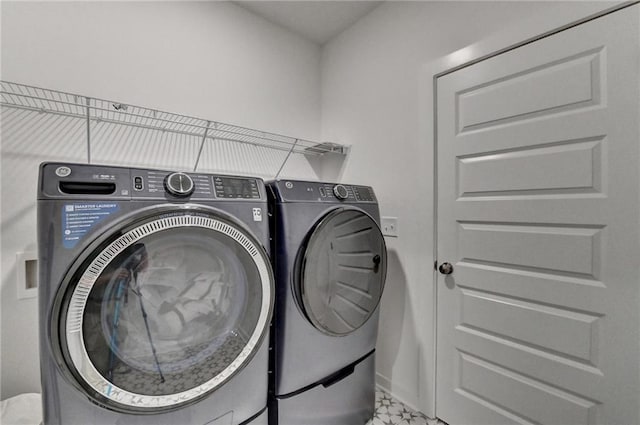 8125 Beryl Overlook, Gainesville, GA 30506 - washroom featuring baseboards, separate washer and dryer, and laundry area