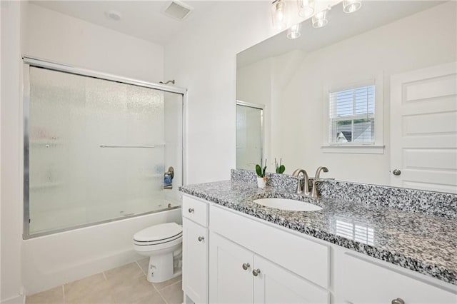 8125 Beryl Overlook, Gainesville, GA 30506 - full bathroom featuring toilet, vanity, tile patterned floors, and enclosed tub / shower combo