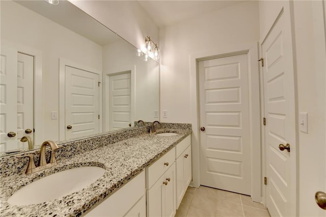 8125 Beryl Overlook, Gainesville, GA 30506 - bathroom featuring tile patterned floors, double vanity, and a sink
