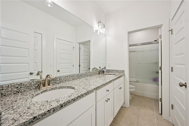 8125 Beryl Overlook, Gainesville, GA 30506 - bathroom featuring double vanity, tile patterned floors, toilet, and shower / bath combination with glass door