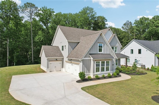 8125 Beryl Overlook, Gainesville, GA 30506 - modern farmhouse featuring board and batten siding, roof with shingles, concrete driveway, a front yard, and a garage