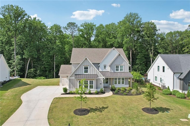 8125 Beryl Overlook, Gainesville, GA 30506 - modern farmhouse featuring board and batten siding, driveway, a standing seam roof, roof with shingles, and a front yard