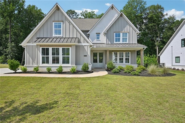8125 Beryl Overlook, Gainesville, GA 30506 - modern farmhouse style home with board and batten siding, a standing seam roof, a front lawn, and french doors
