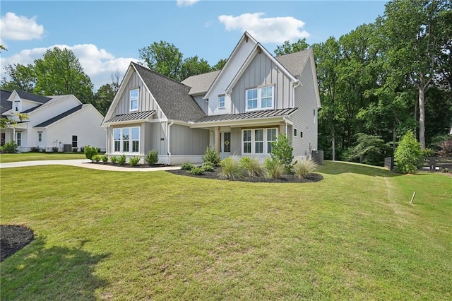 8125 Beryl Overlook, Gainesville, GA 30506 - view of front facade featuring board and batten siding, a standing seam roof, a front yard, and metal roof