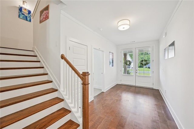 8125 Beryl Overlook, Gainesville, GA 30506 - foyer entrance featuring stairs, wood finished floors, baseboards, and crown molding