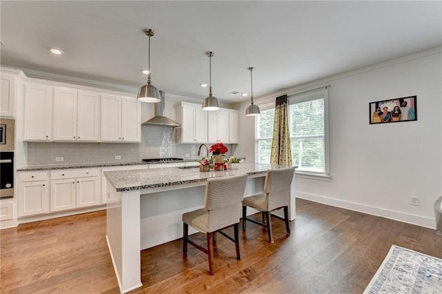 8125 Beryl Overlook, Gainesville, GA 30506 - kitchen with wall chimney exhaust hood, appliances with stainless steel finishes, decorative backsplash, and white cabinetry